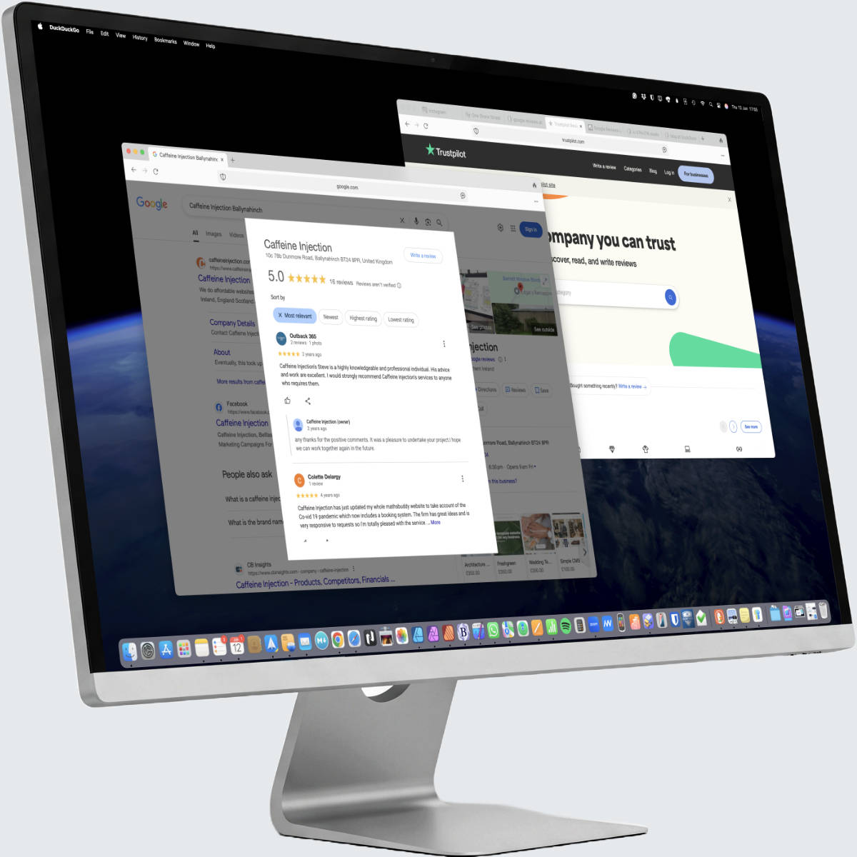 A modern desktop computer monitor displaying a colourful website promoting website design in Northern Ireland and the UK.